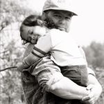 father holding child in his arms